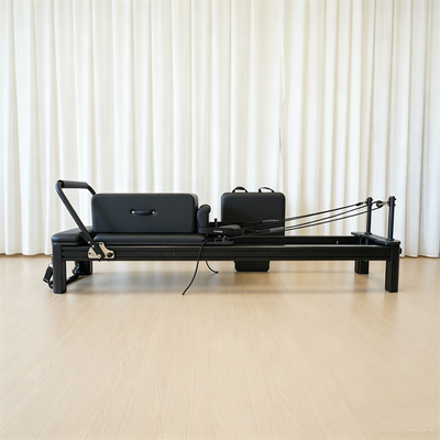 Calidad Engranaje de encargo del entrenamiento del gimnasio del logotipo de la cama completa del reformador de Pilates de la pista completa de aluminio negro mate al por mayor Fábrica